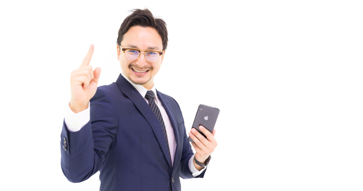 Man-holding-iPhone-and-raising-index-finger